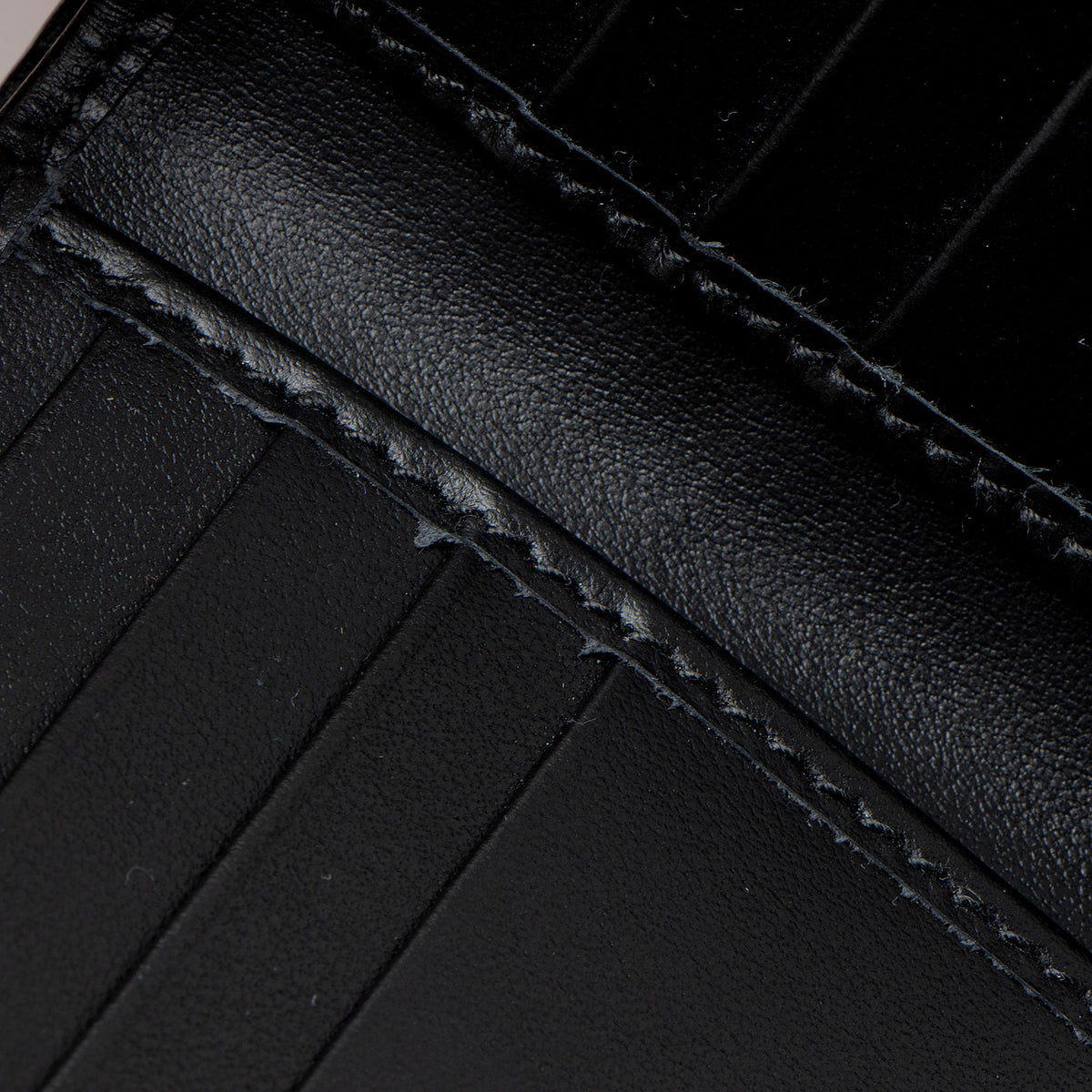 Gucci GG Embossed Silver Bifold Wallet