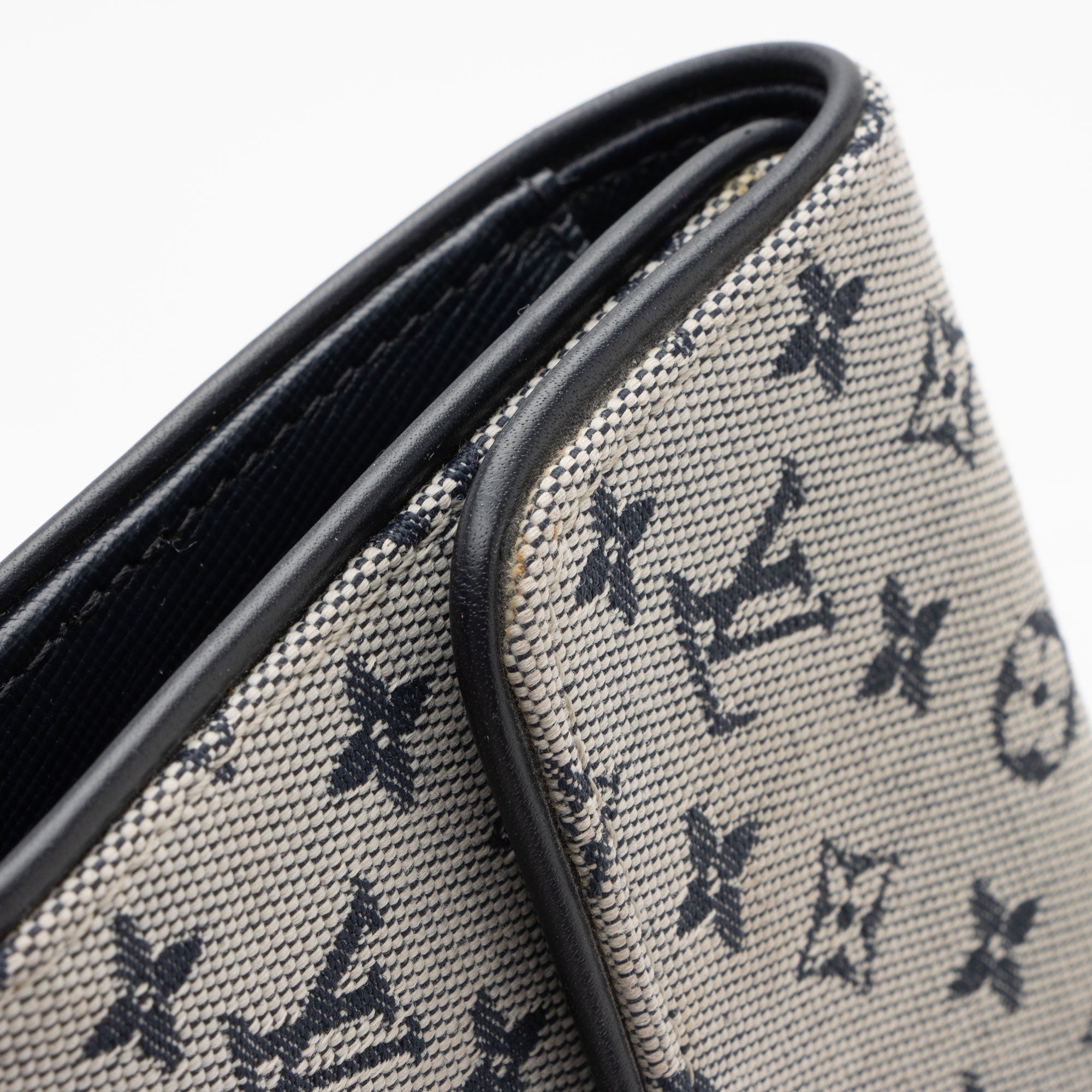 Louis Vuitton Monogram Mini Lin Porte Tresor International Wallet (SHF-NQBrFE)