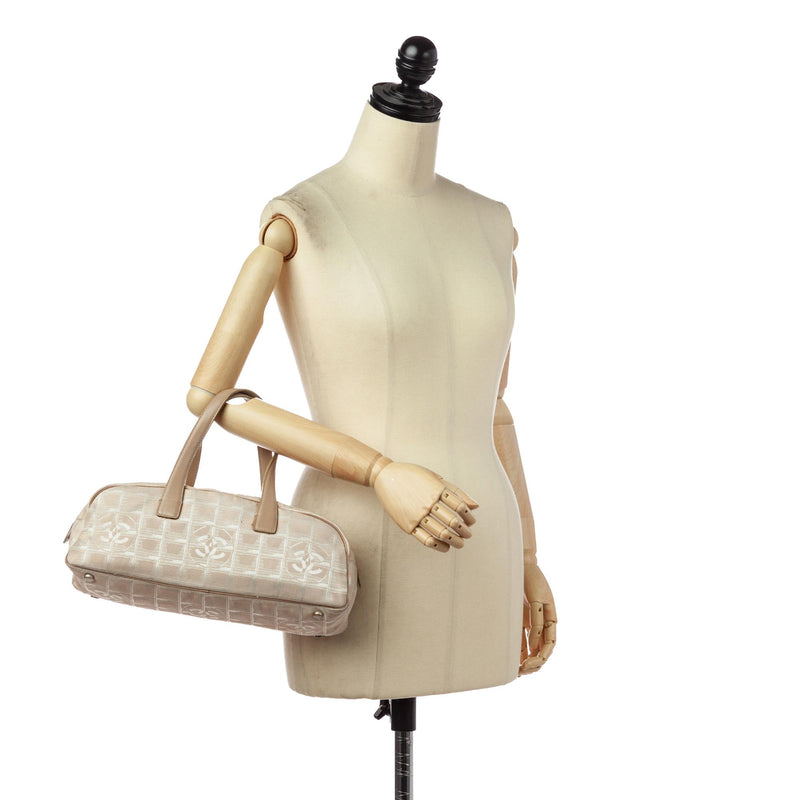 Chanel New Travel Line Canvas Handbag (SHG-1dbBYl) – LuxeDH