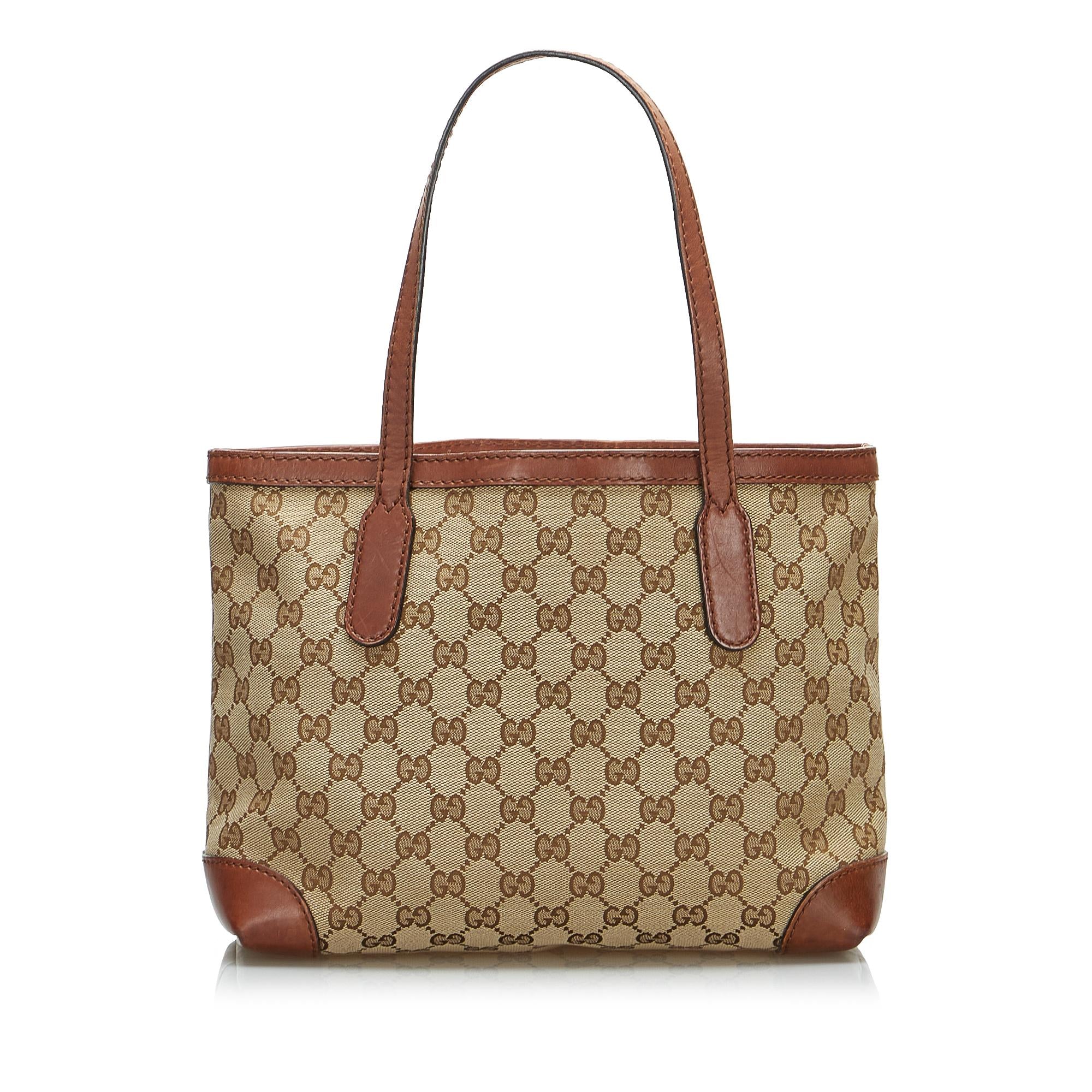 Gucci GG Canvas Stirrup Handbag (SHG-4H8XJO)