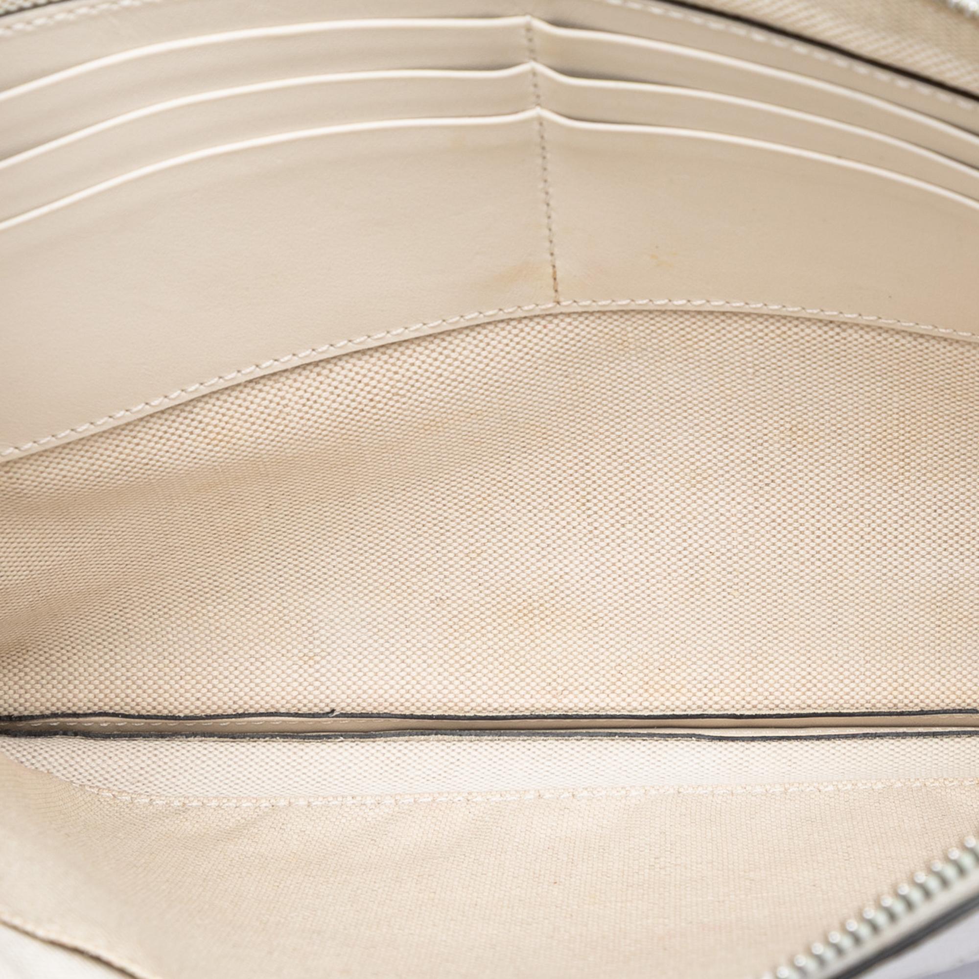 Gucci GG Embossed Perforated Calfskin Wristlet Clutch