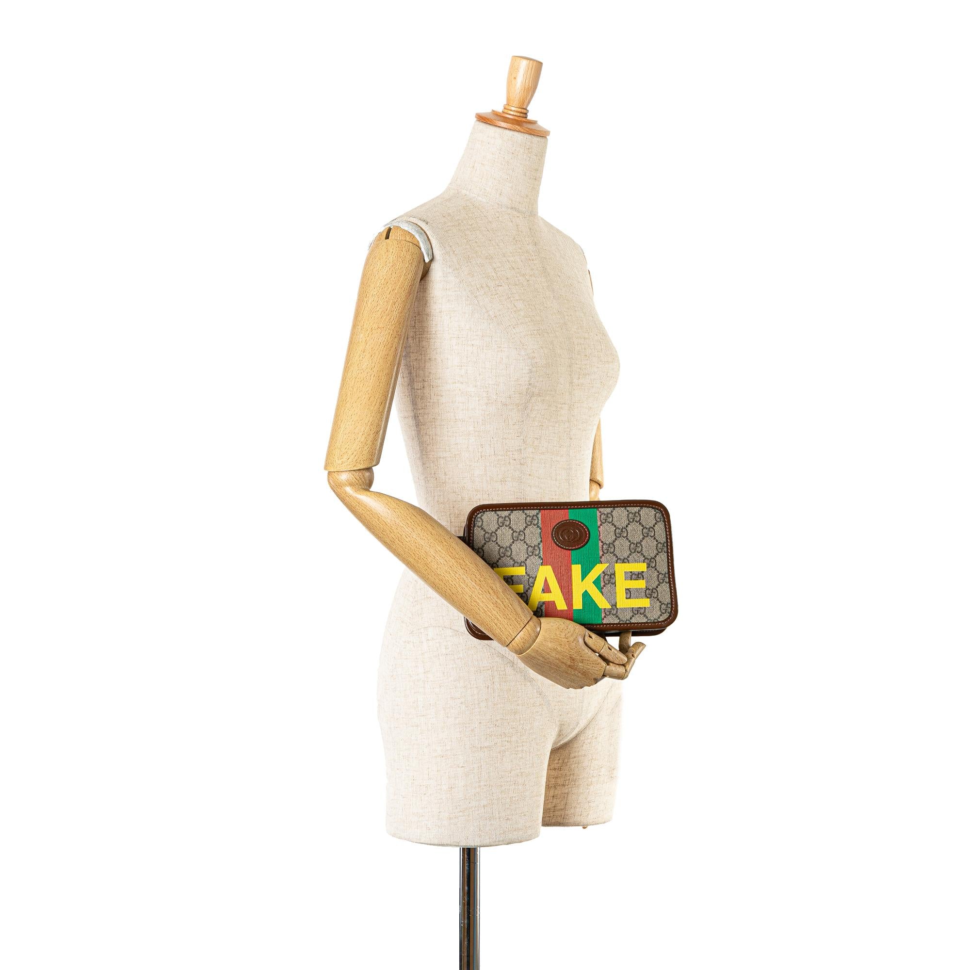 Gucci GG Supreme Fake/Not Cosmetic Pouch