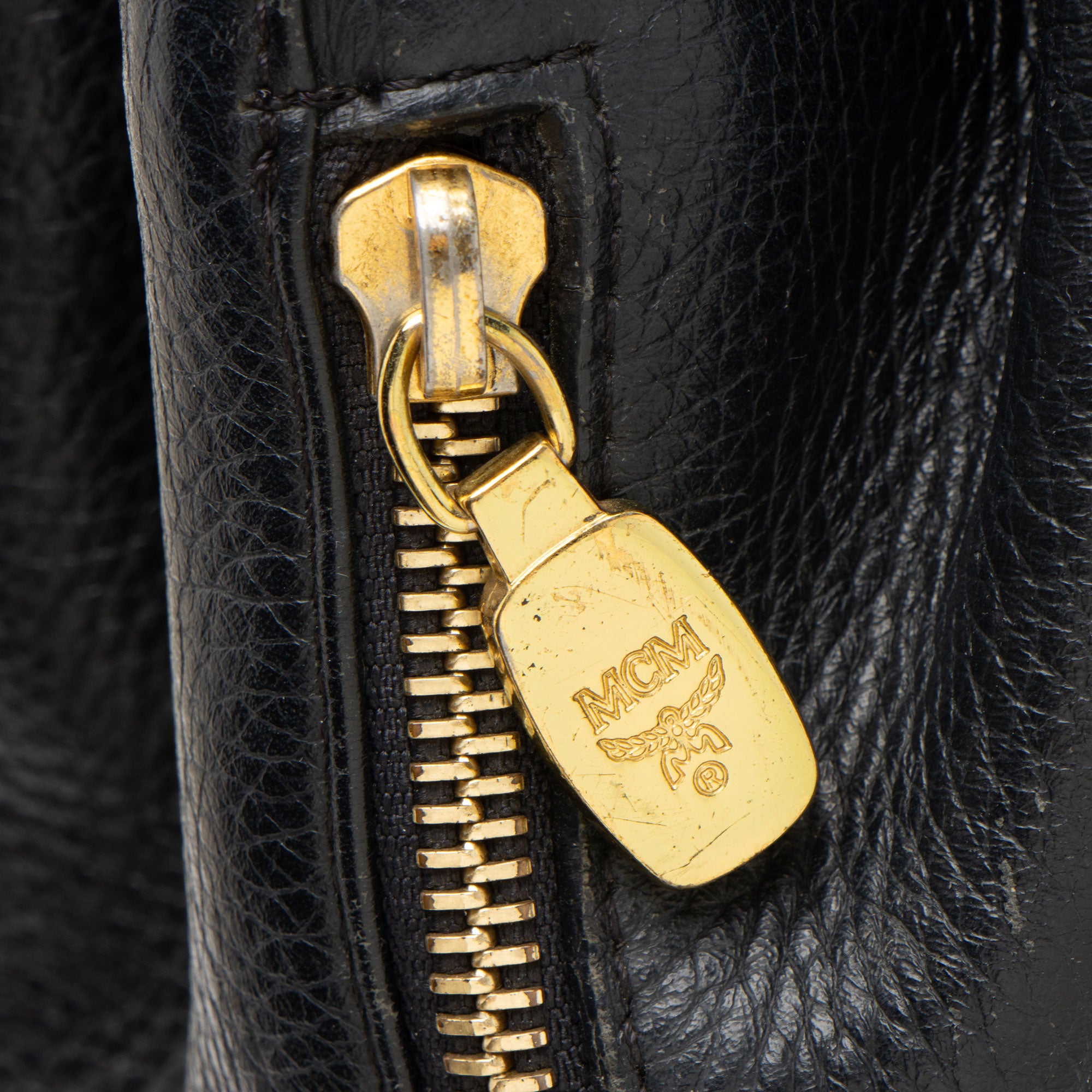 MCM Vintage Leather Logo Charms Drawstring Backpack