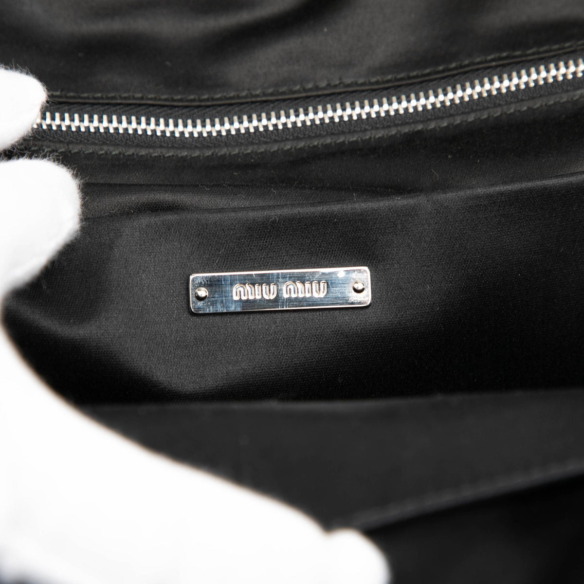 Miu Miu Leather Trimmed Crystal Embellished Matelasse Nylon Backpack