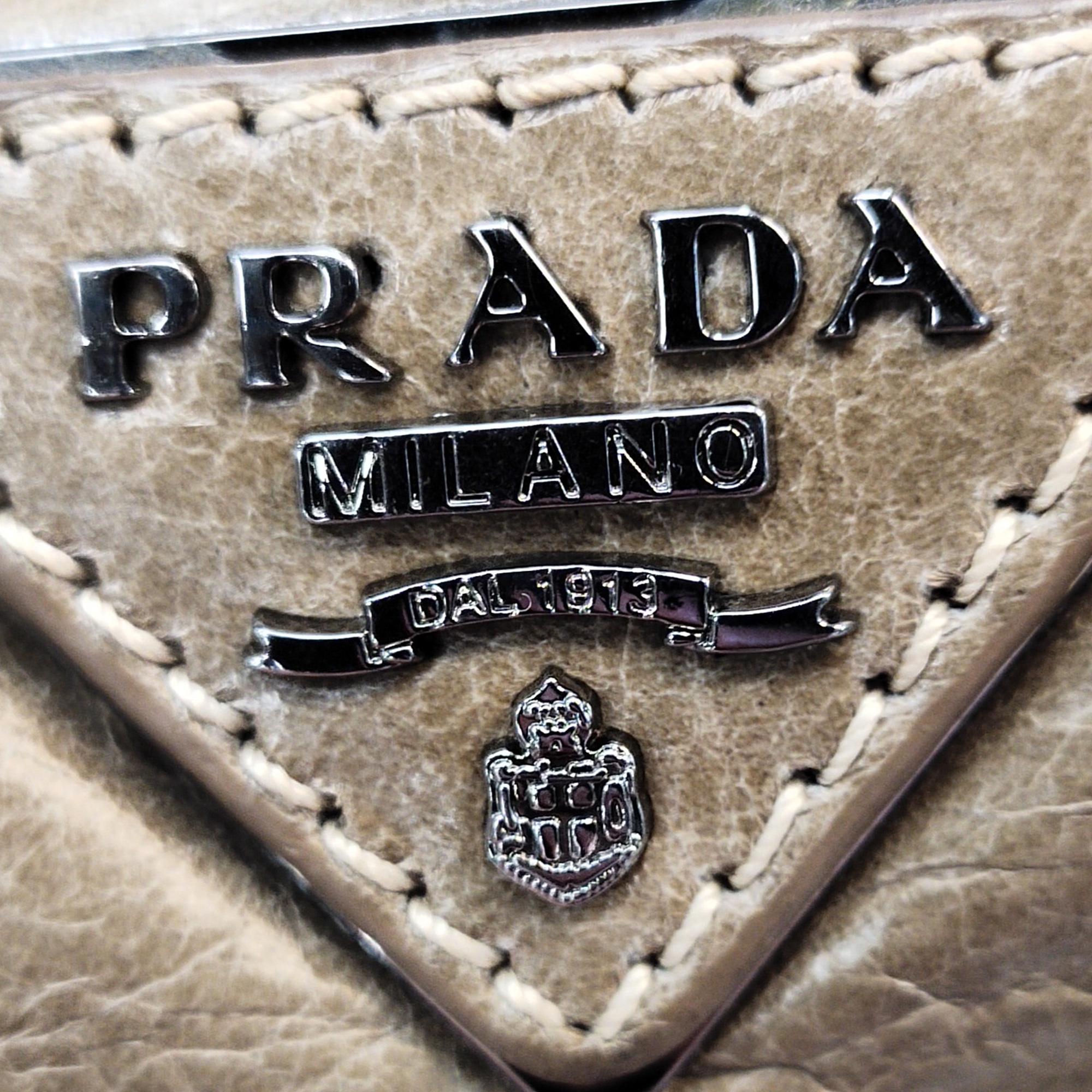 Prada Vitello Shine Turn Lock Baguette (SHG-kNYA2Z)