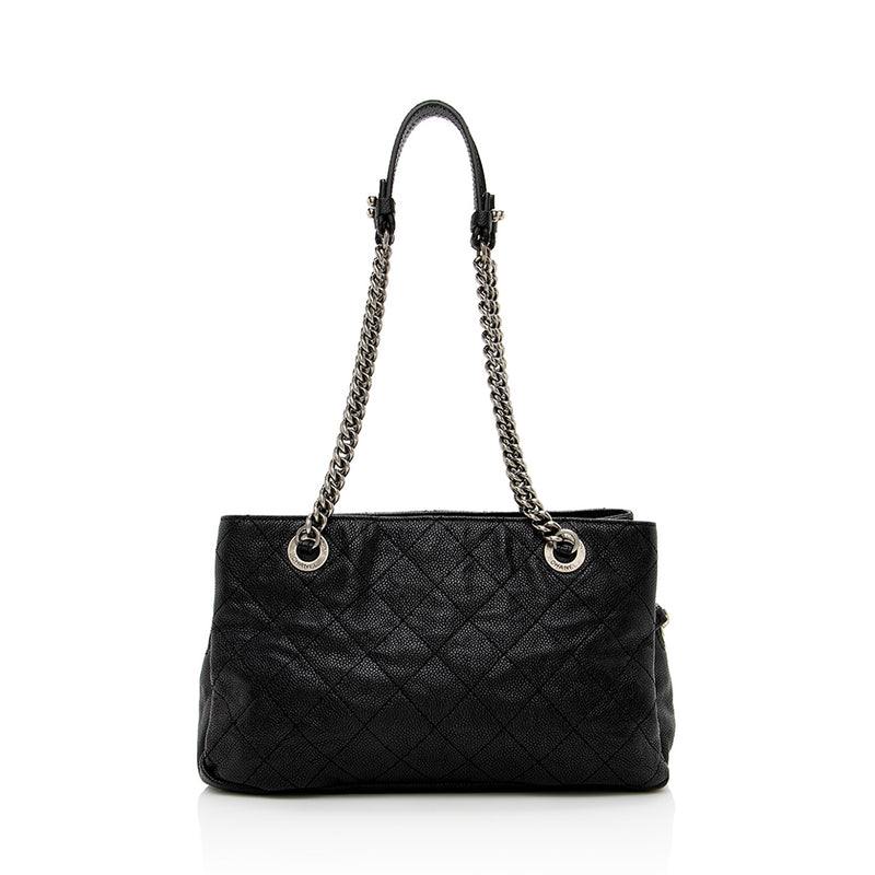 chanel quilted caviar bag black