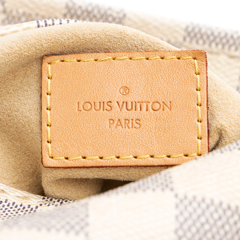 How To Spot a Fake Louis Vuitton Artsy MM