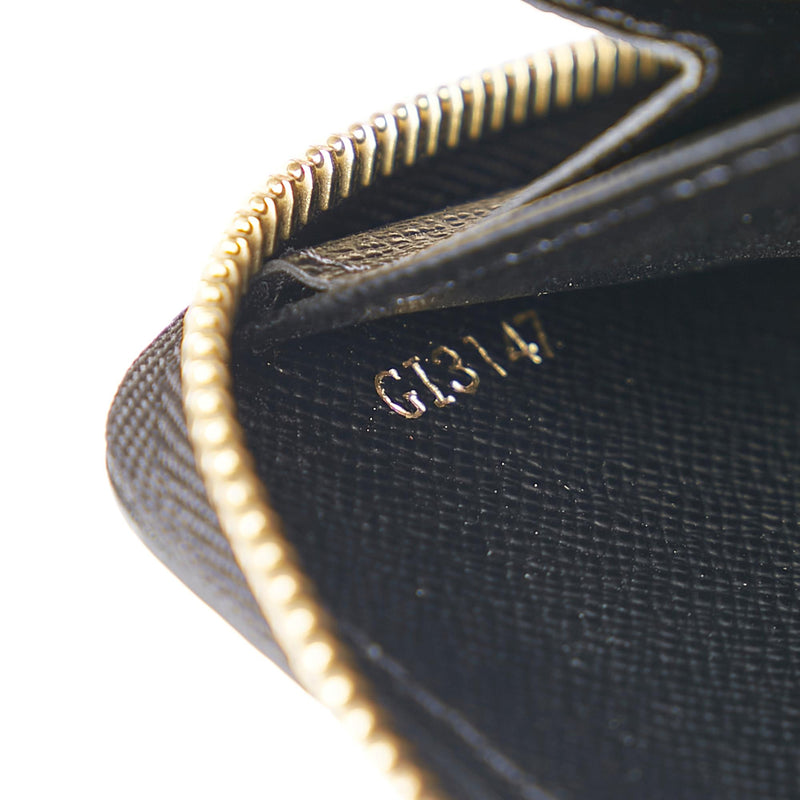 Louis Vuitton Monogram Taurillon Illusion Vertical Zippy Wallet (SHG-K –  LuxeDH