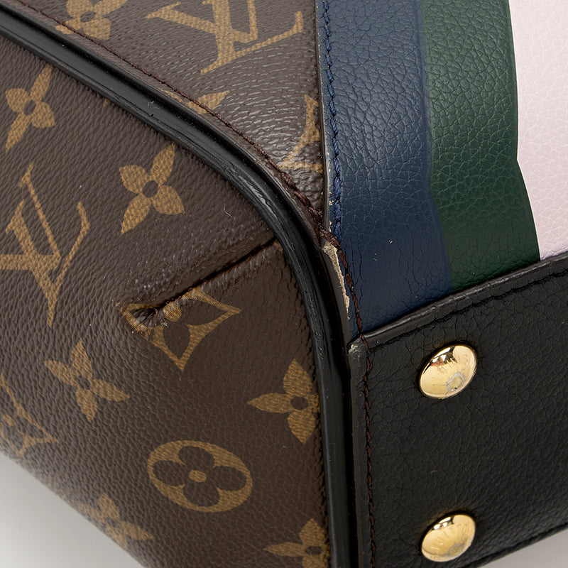 Louis Vuitton Monogram Kimono Handbag. This sophisticated handbag