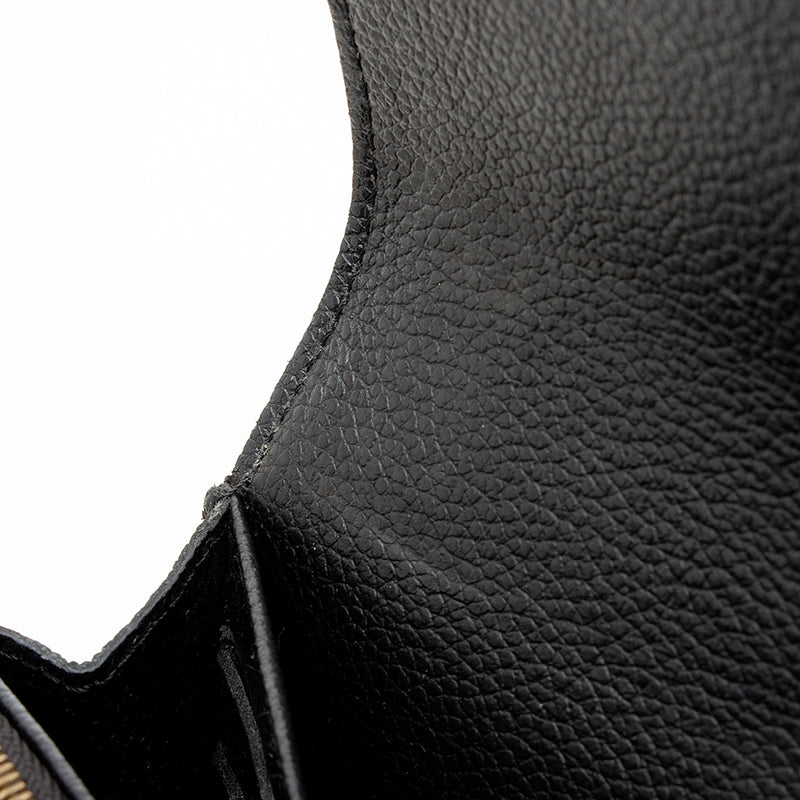 Louis Vuitton Women's Beige Monogram Empreinte Leather Sarah Wallet M68708  – Luxuria & Co.