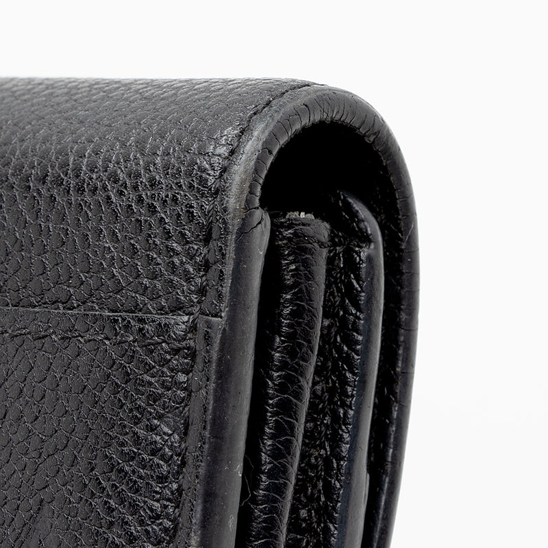 Authentic Louis Vuitton Black Monogram Empreinte Leather Sarah Wallet –  Paris Station Shop