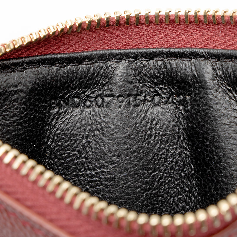cassandre matelassé zipped pouch in grain de poudre embossed leather
